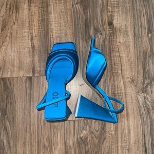 Turquoise satin sling backs.